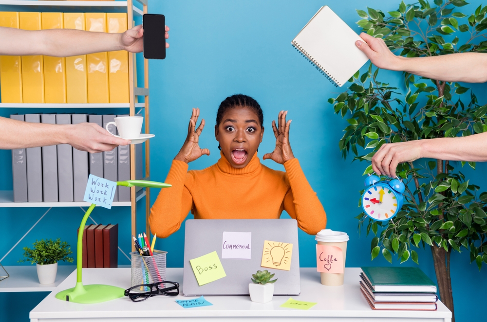 Overwhelmed studio owner juggling social media tasks